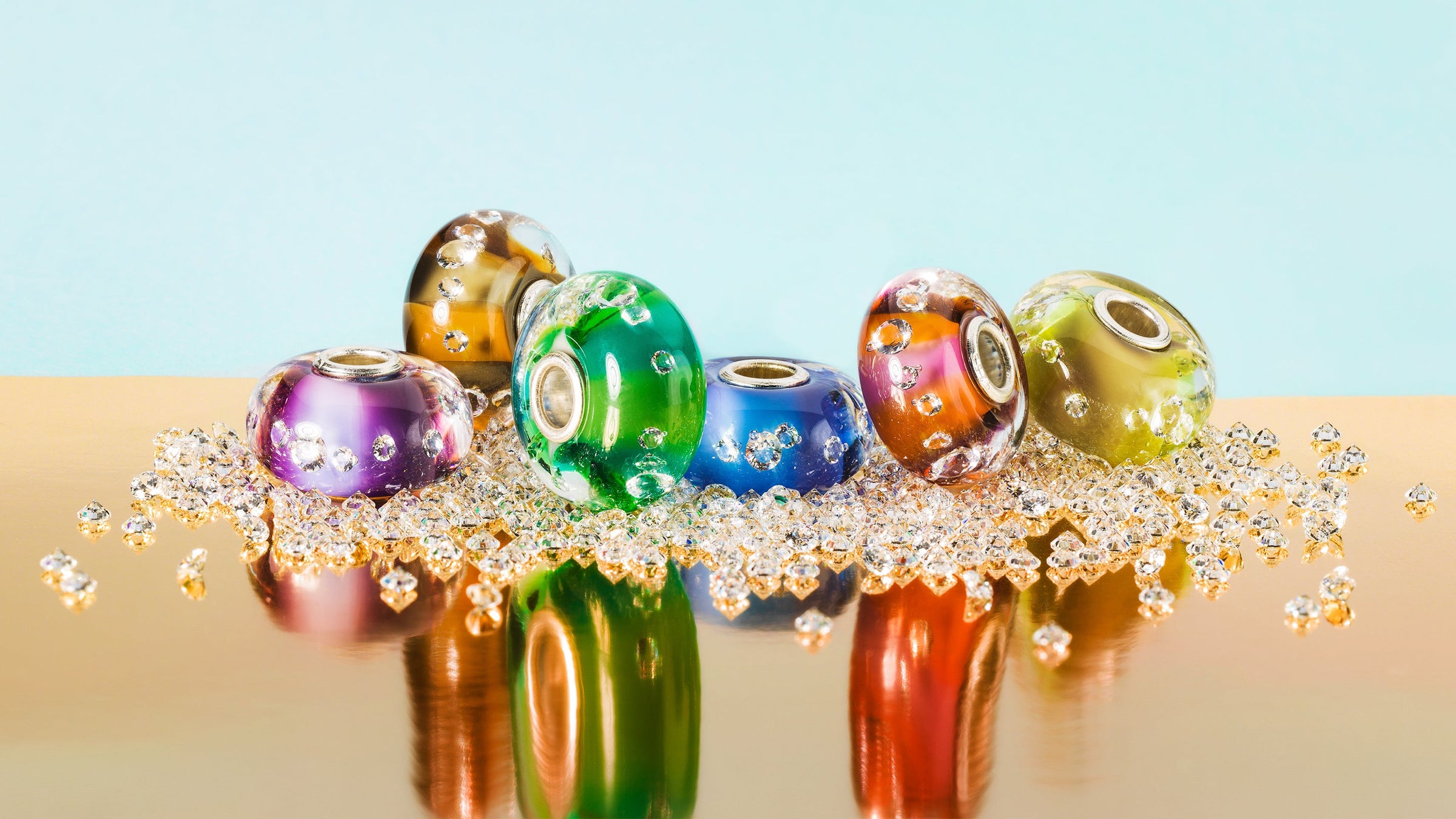 6 new Murano glass beads sparkling with 13 zirconia embedded over a layer of delicate two-toned pastels, on a bed of Zirconia