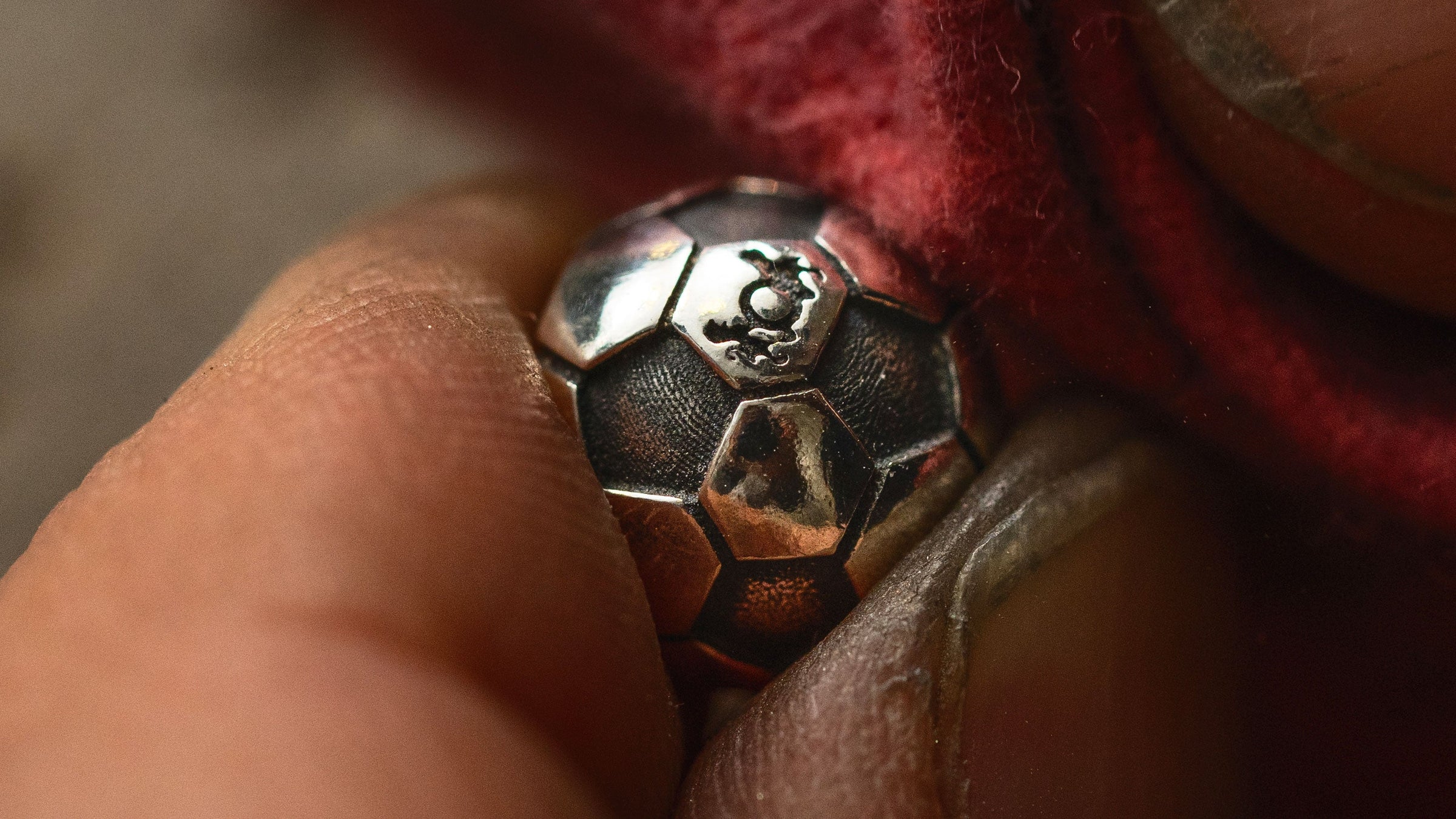Trollbeads silver Football Passion bead being polished