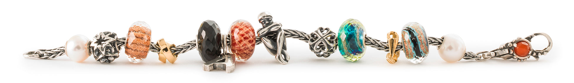 Trollbeads foxtail bracelet with beads in pearl, glass, silver, and stone, symbolizing the felling of togetherness